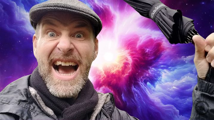 The Speaker's A Fool CJB with an unbrella and space behind him