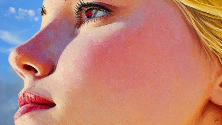 BLONDE WOMAN LOOKING SKYWARD WITH CLOUDS IN THE BACKGROUND BLOWING BY