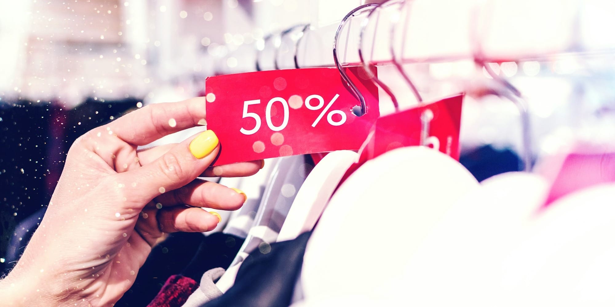 person holding red and white love print gift wrapper