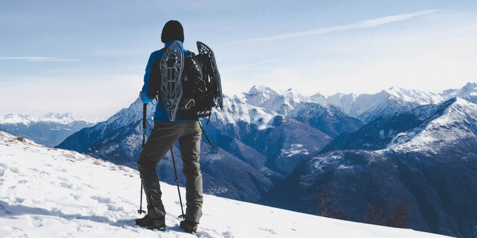 man walking on snow mountain