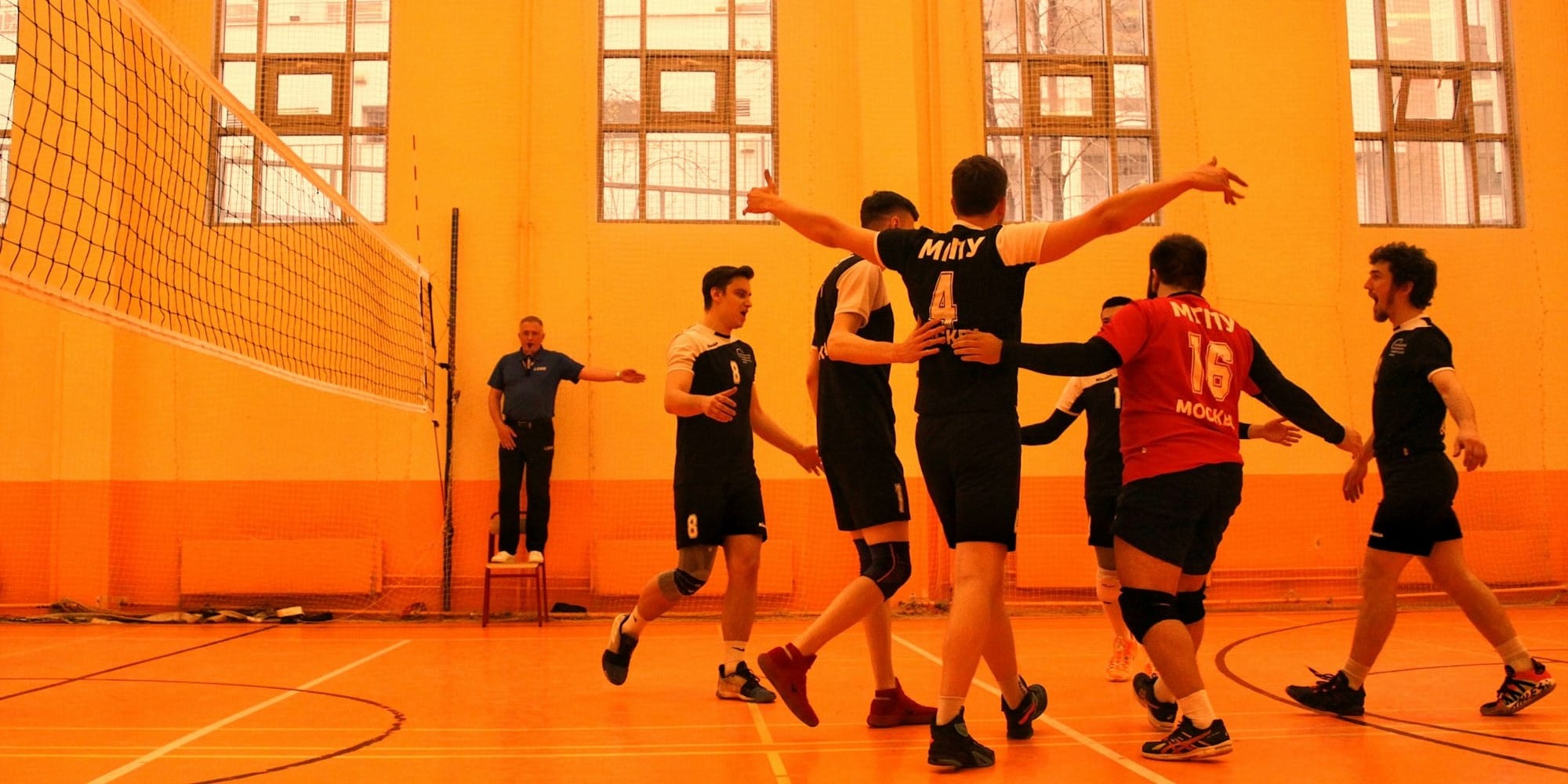 group of men playing basketball