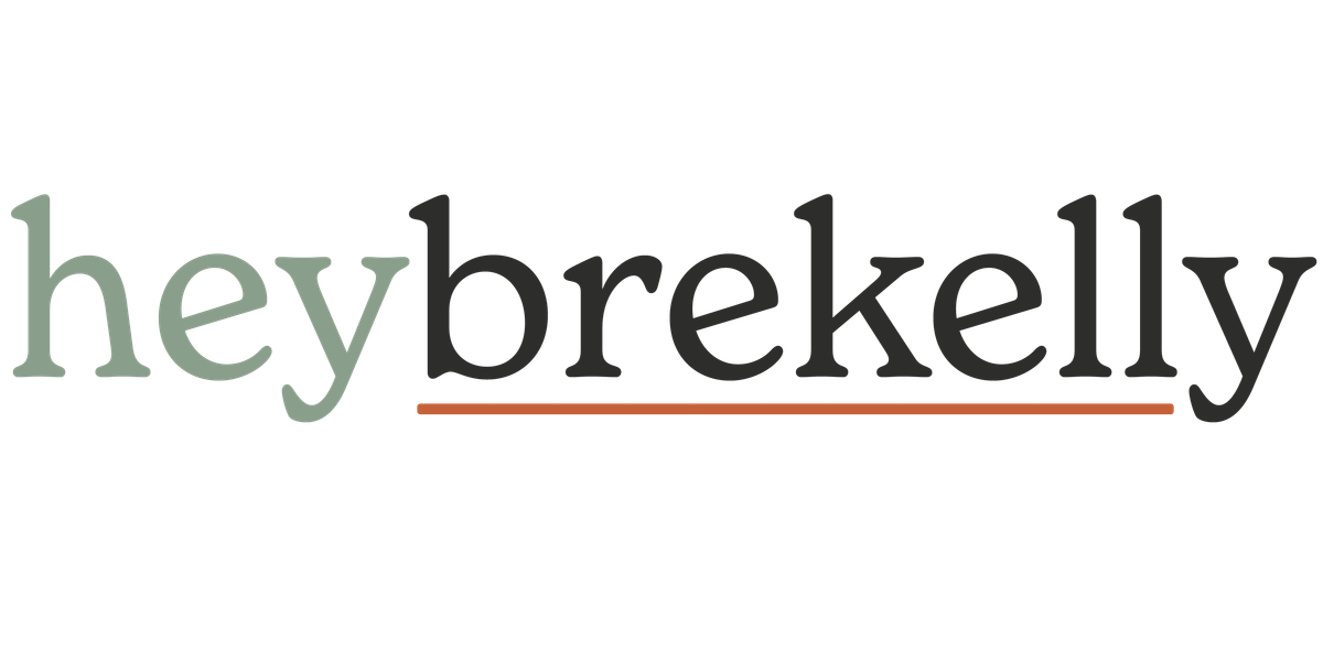 heybrekelly word mark. "hey" in sage green, "brekelly" in deep charcoal and underlined with a dusty ember line.