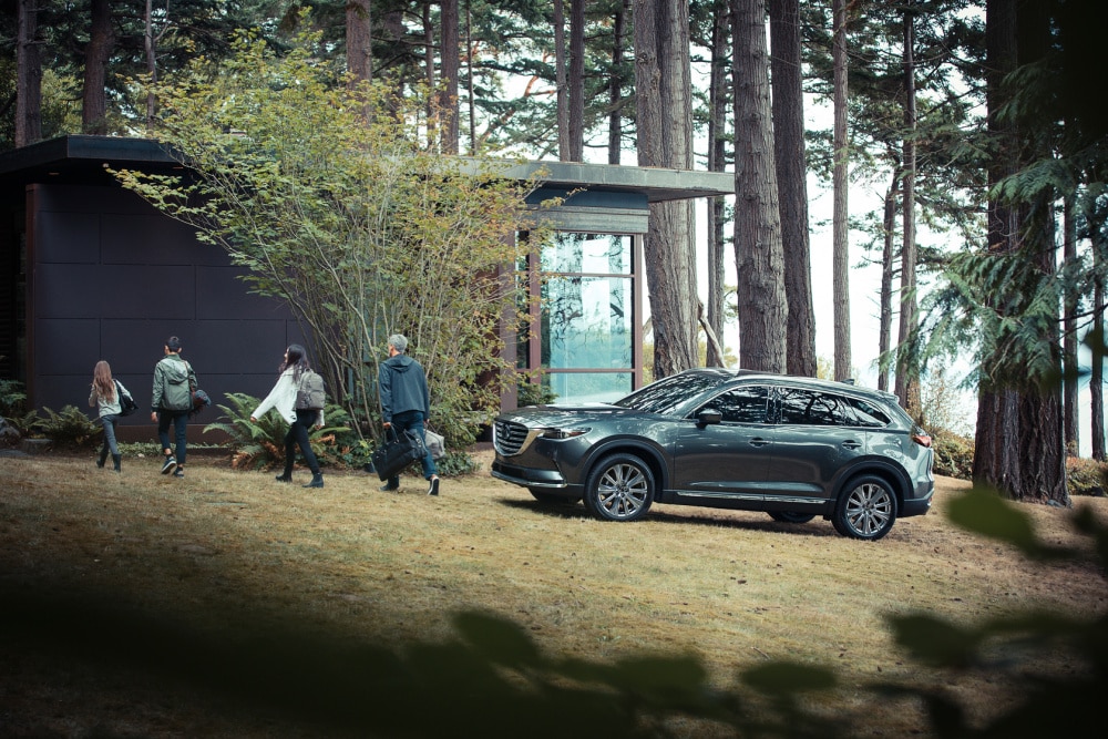 Family walking away from 2022 Mazda CX-9 SUV