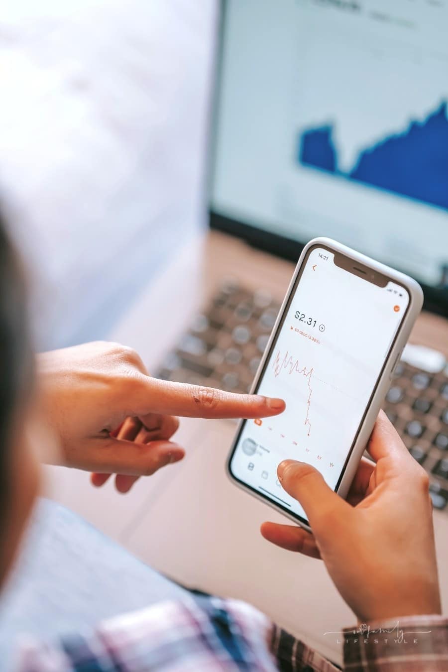 woman looking at stocks on mobile app