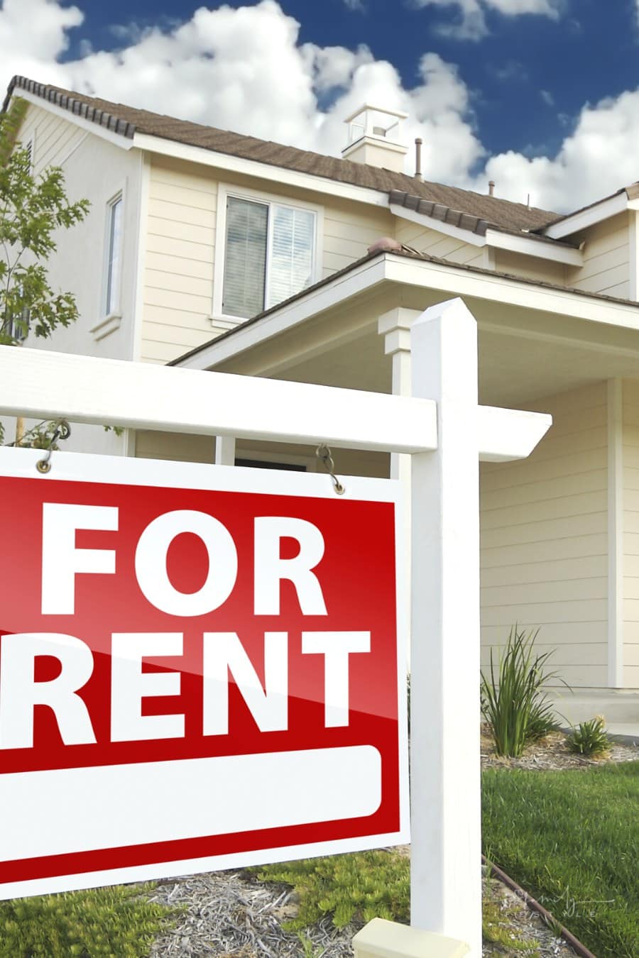red for rent sign in front of residential house