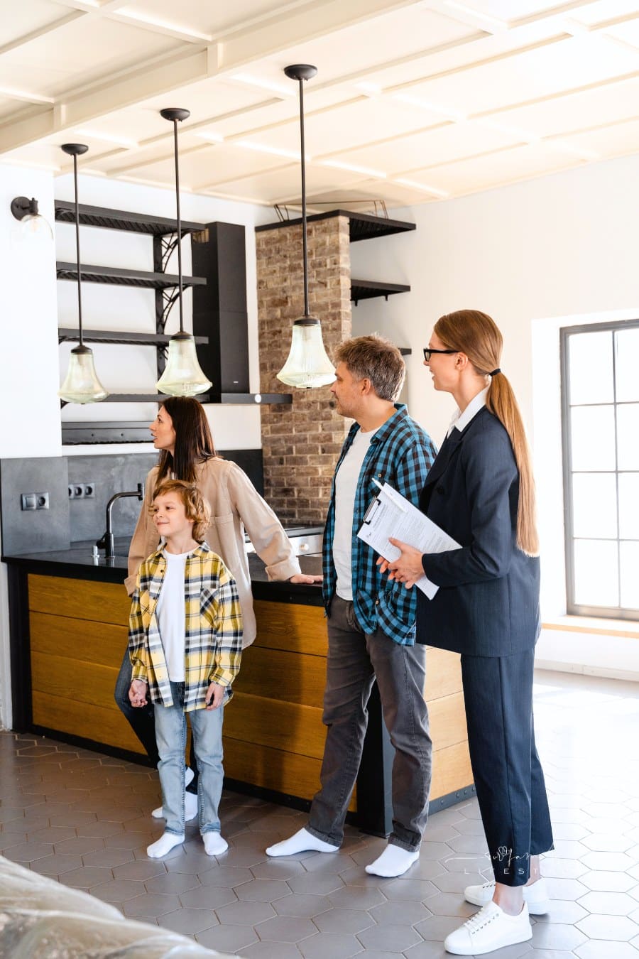 A Family Touring a House with a Real Estate Agent
