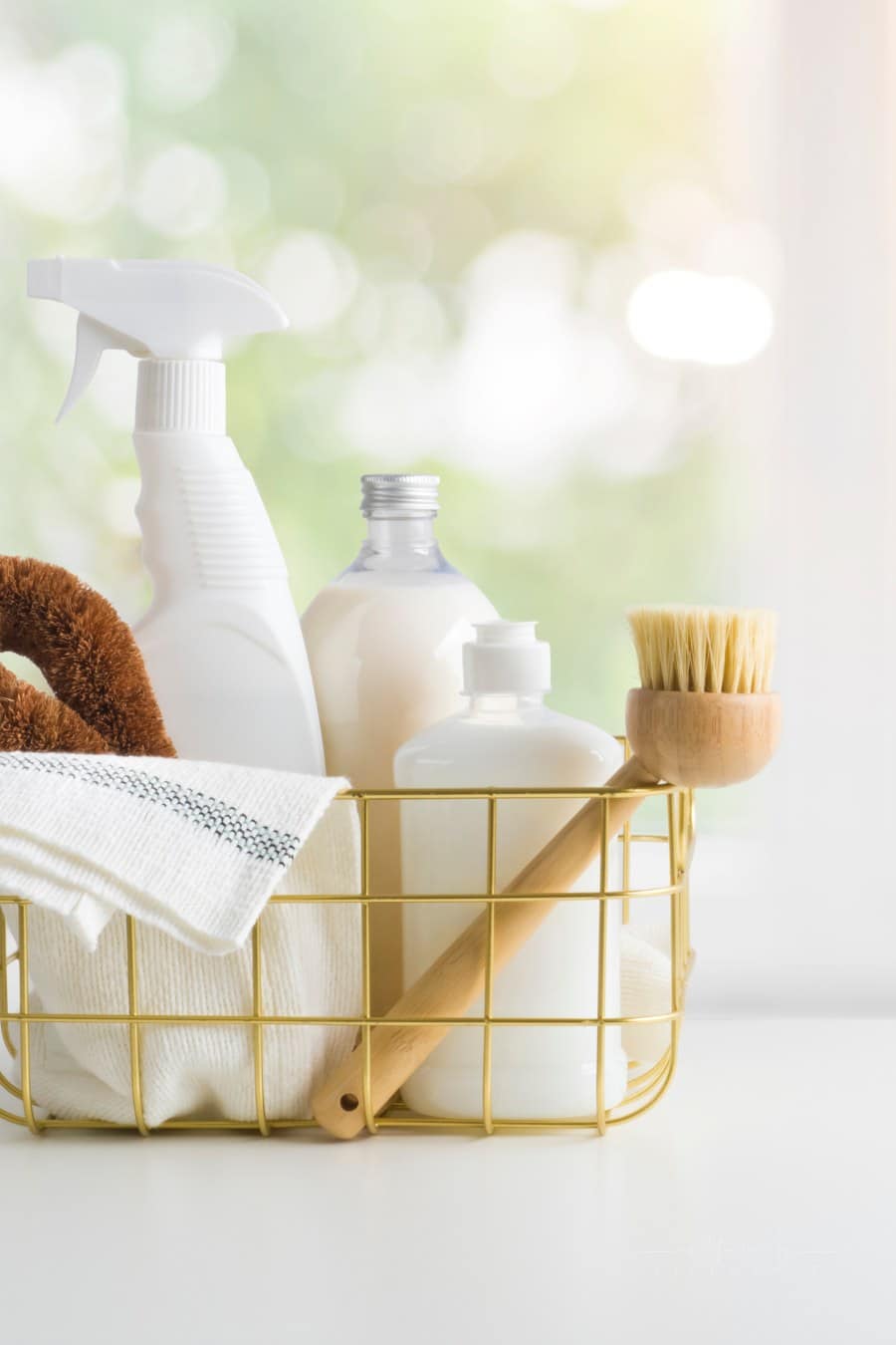 Eco-friendly natural cleaning products on table and window background