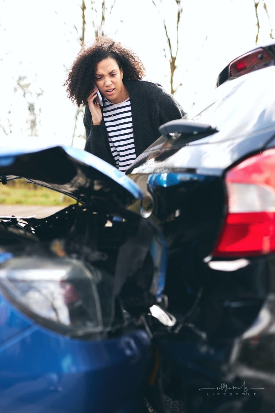woman calling police after car accident