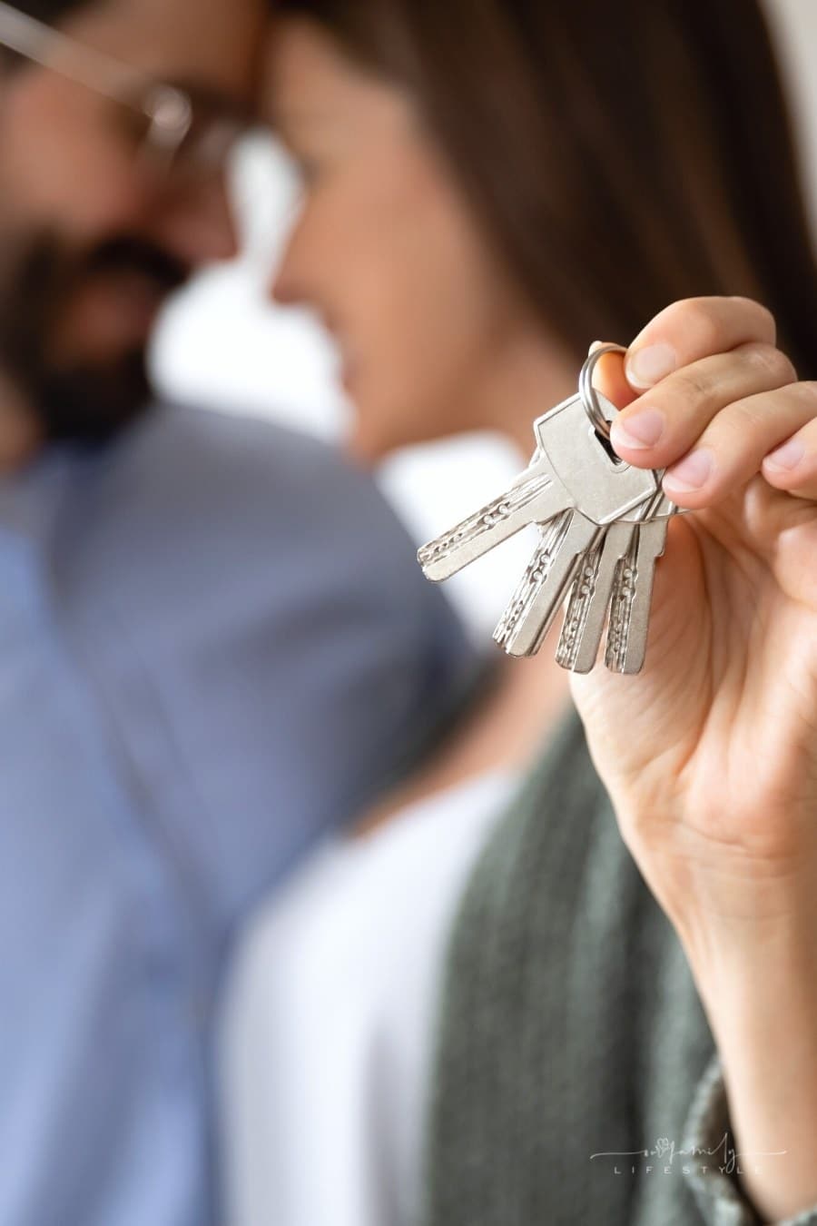 close up of couple celebrating keys to new house