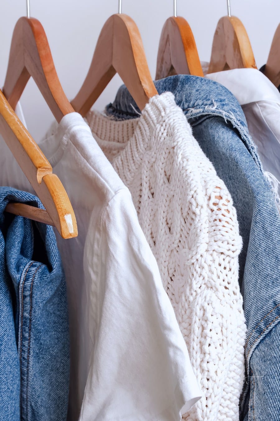 Woman minimalist wardrobe in white and denim