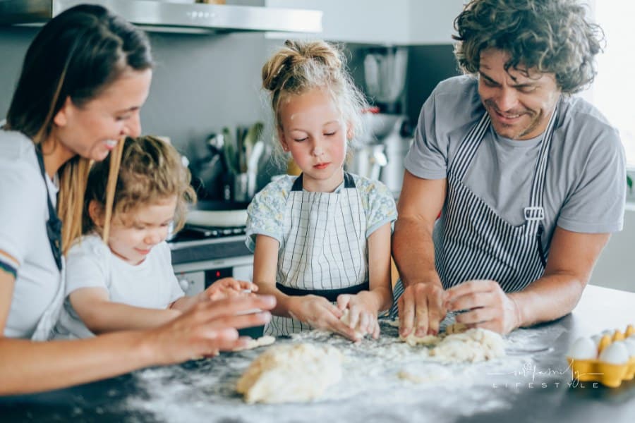 Young family having fun in the kitchen