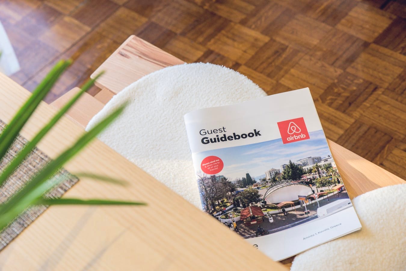 Airbnb Guest Guidebook on a modern table