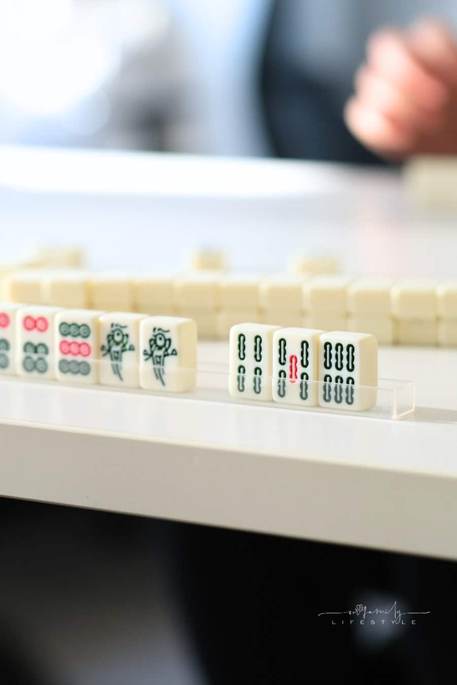people playing Chinese mahjong game