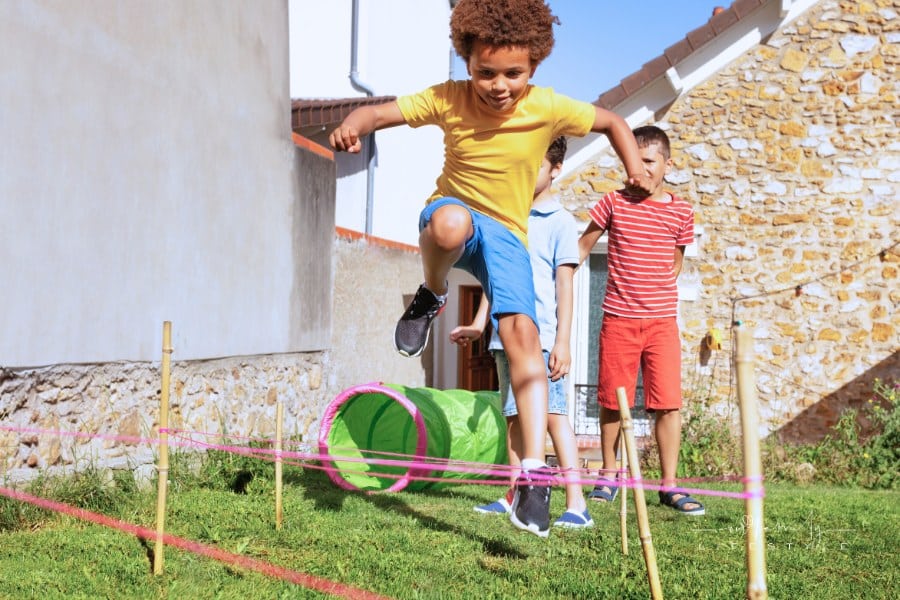 Race with Obstacles Children Jump over Barrier
