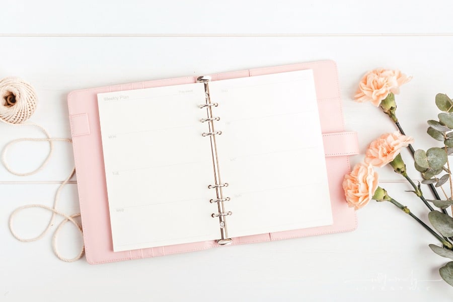 open pink planner with flowers