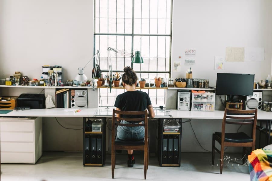 Rear view of artist freelancing at home