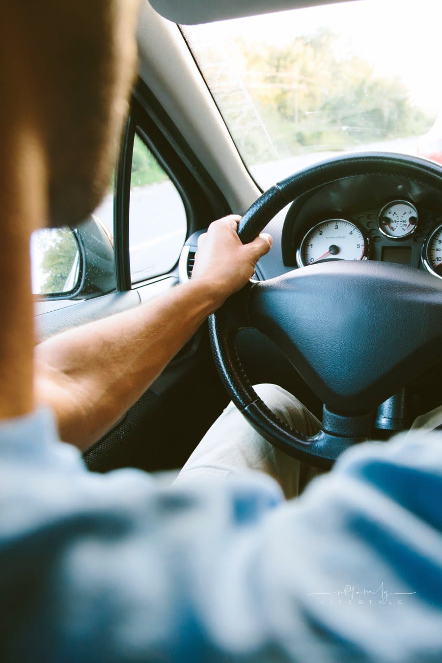 close up of man driving car