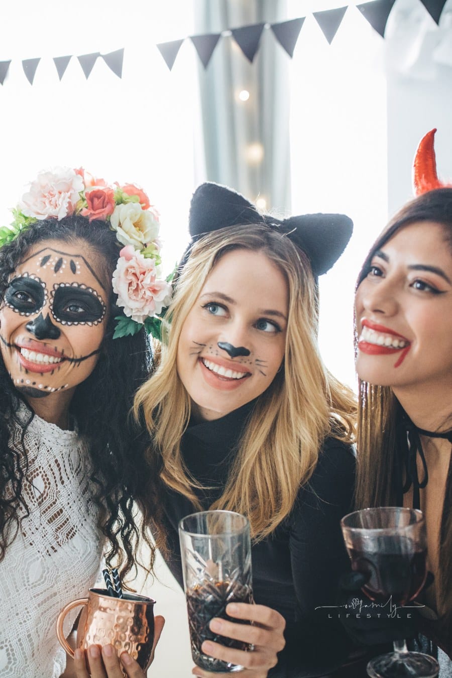 Group of Young people at home celebrating Halloween in costumes, they taking selfie