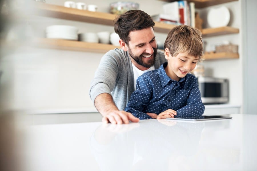 Shot of a father and his young son using a digital tablet together at home