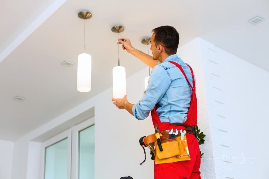 Electrician Man Worker Installing Ceiling Lamp