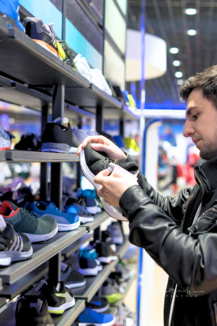 man shopping for athletic shoes