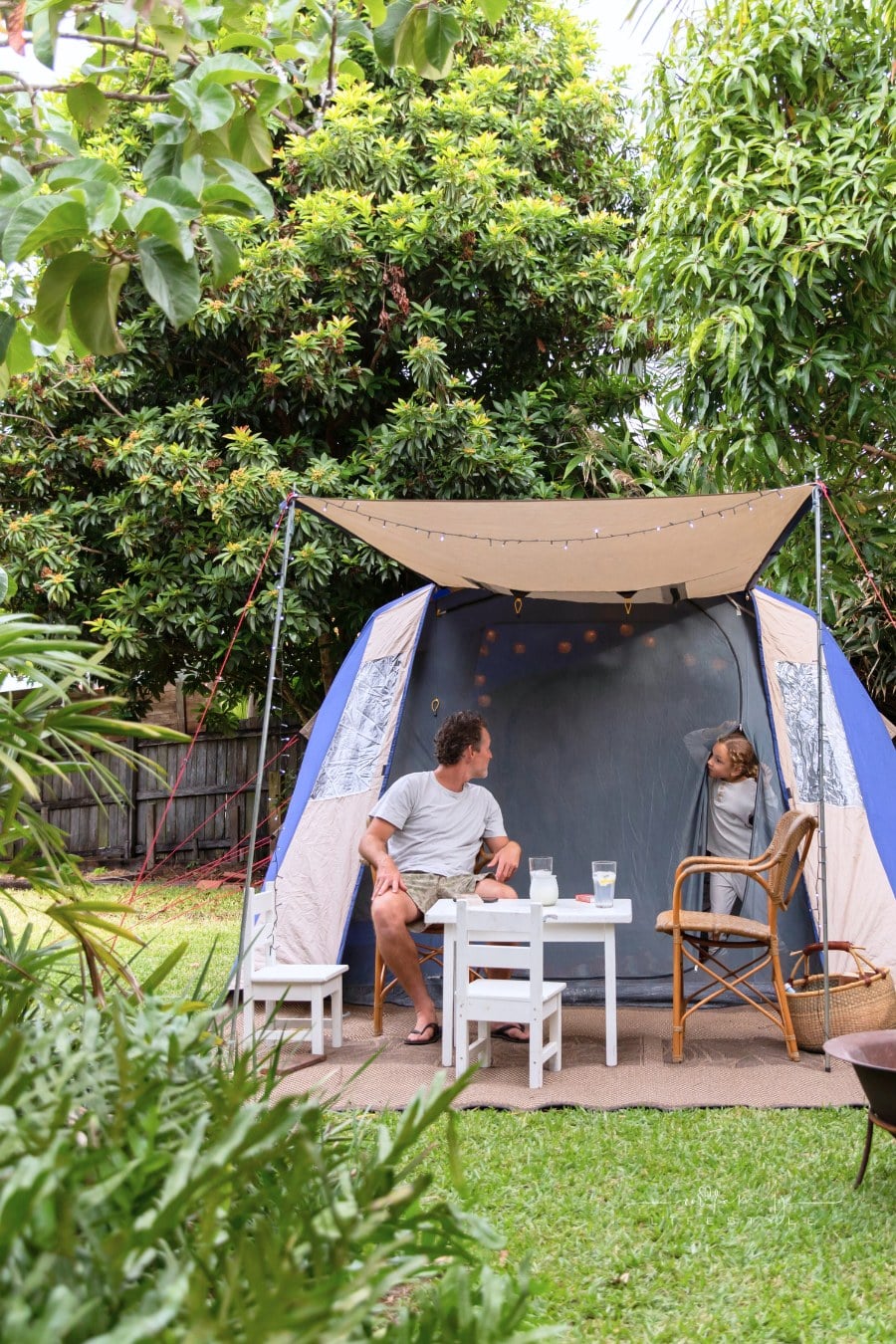 Dad and Daughter Tent Camping in the Backyard