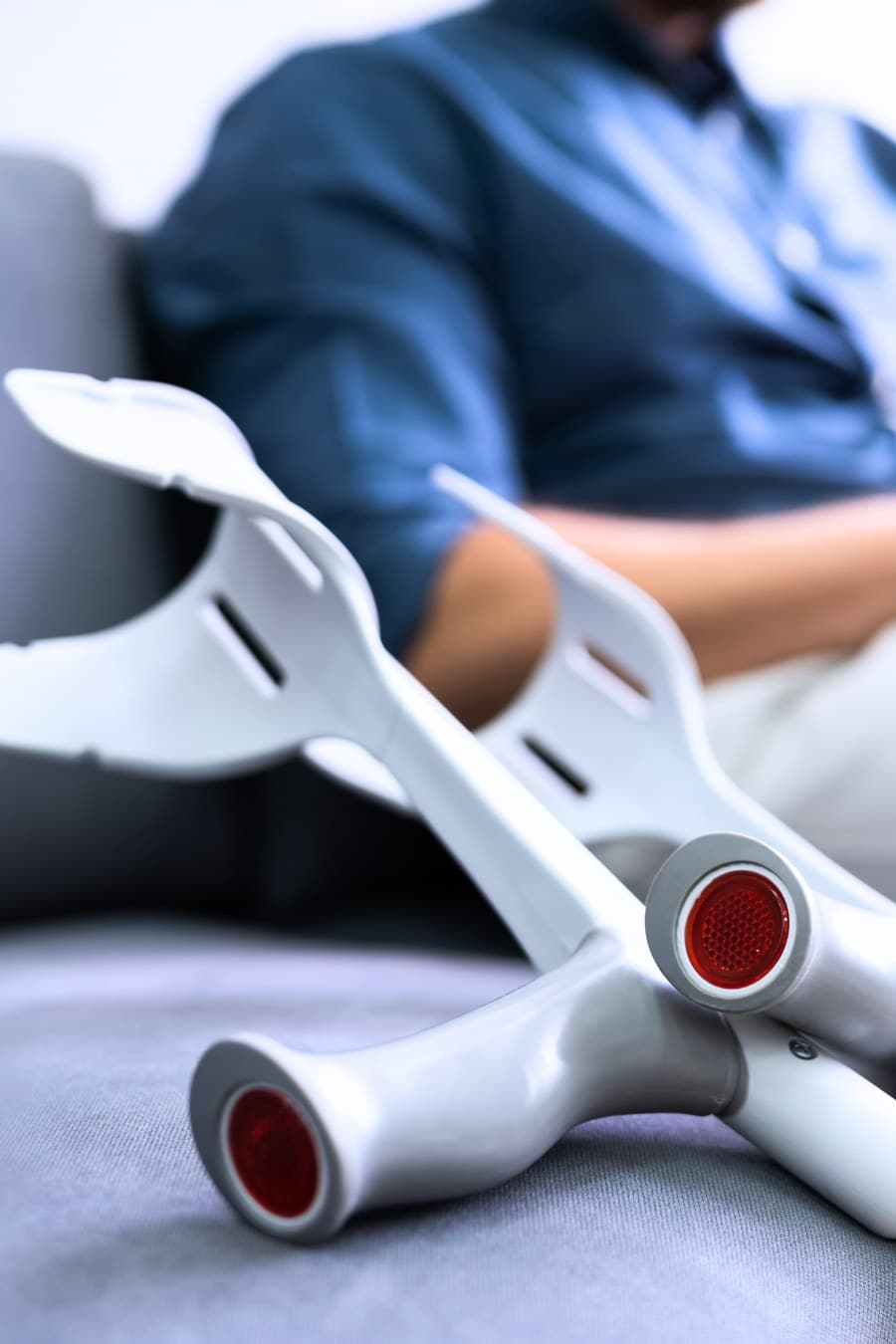 Man With Leg Injury Using Laptop