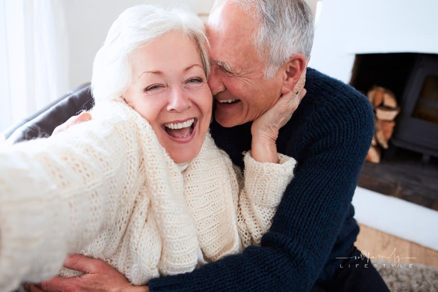 Senior Couple Sitting on Sofa and Taking a Selfie
