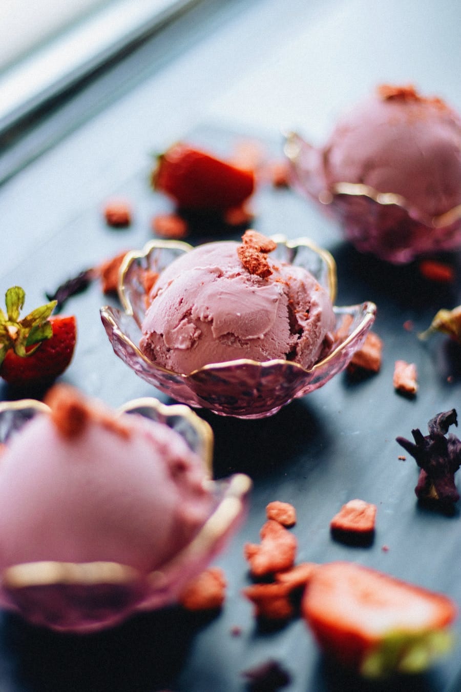 Elegant display of strawberry ice cream with gourmet presentation.