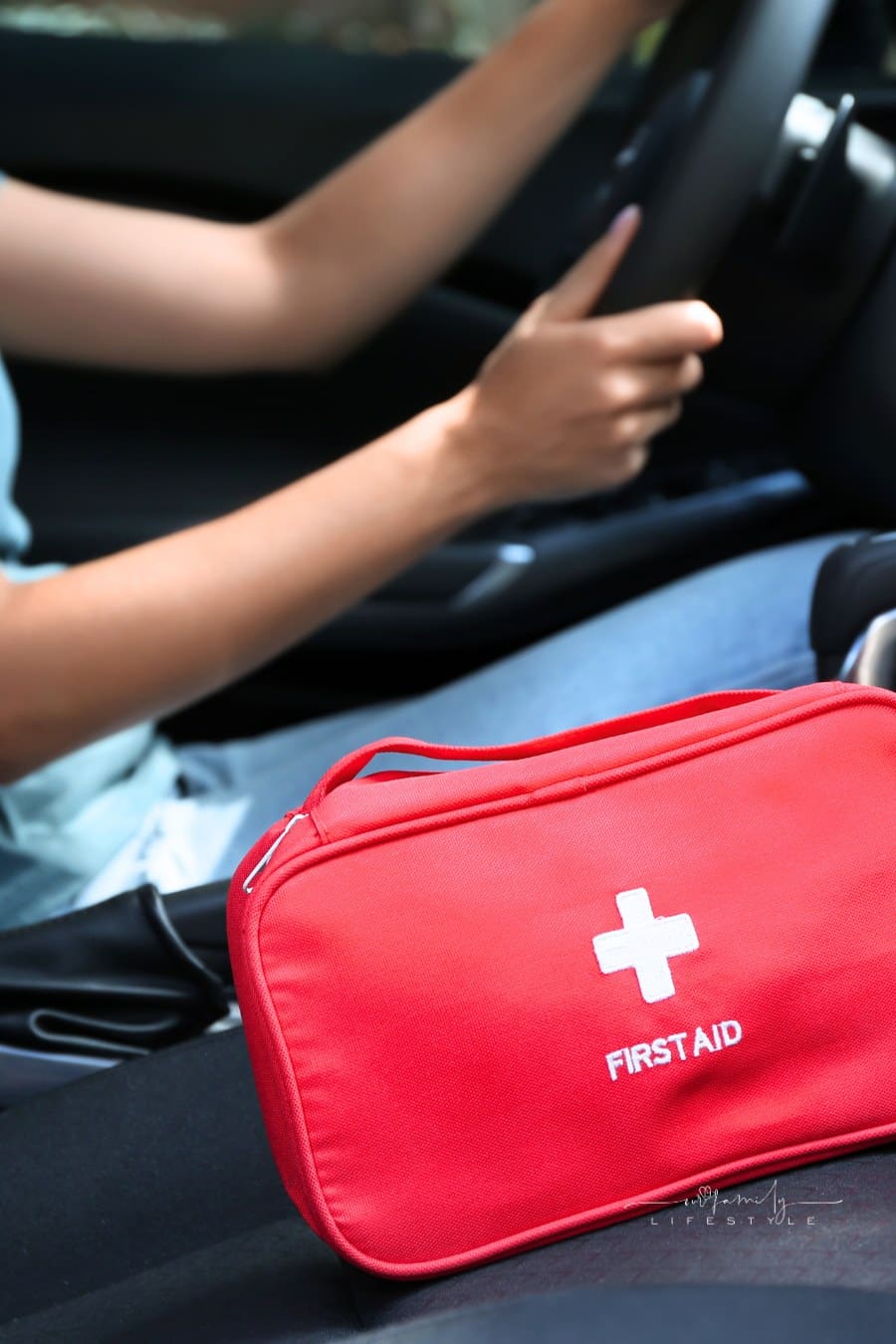 Driver with First Aid Kit in Car