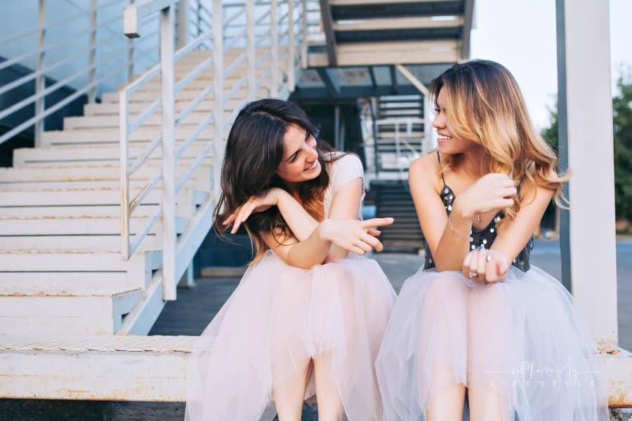 Fashion Attractive Women Sitting on Stairs in Tulle Skirts