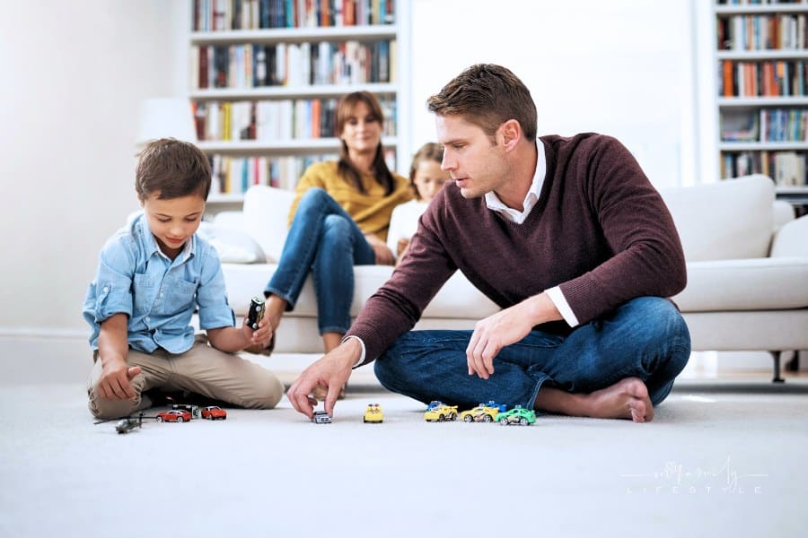 Father and son picking out their favorite cars