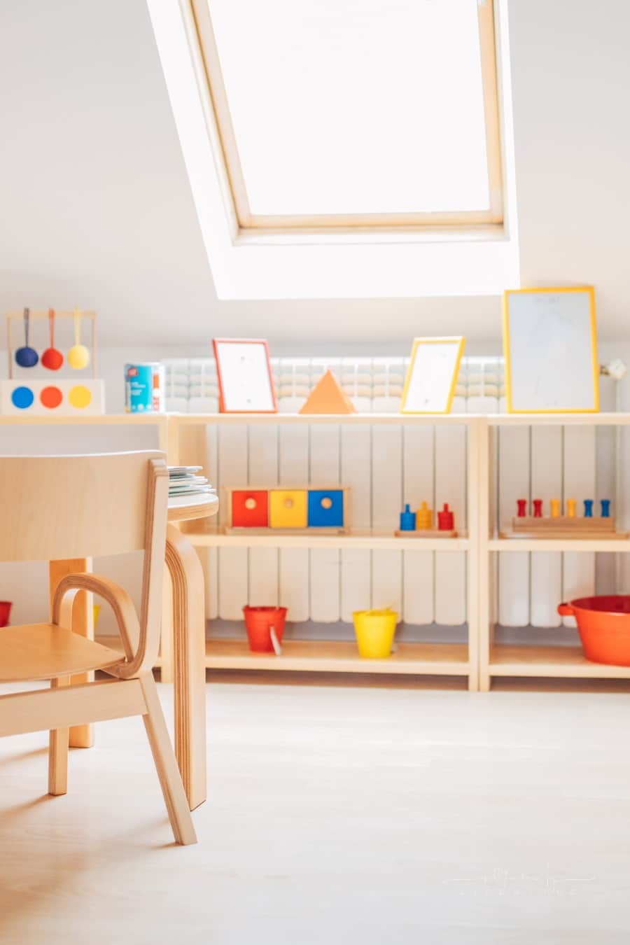 bright preschool classroom with natural light and wooden furniture