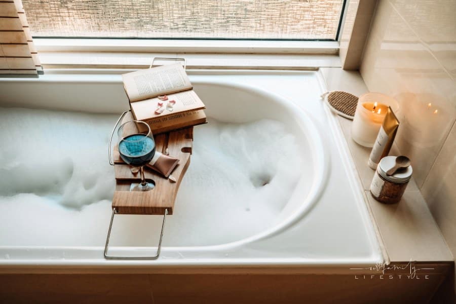 Book, Wine, and Skincare Products at the Tub