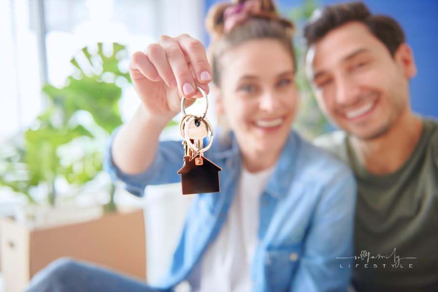 Young Couple with Keys of their New House