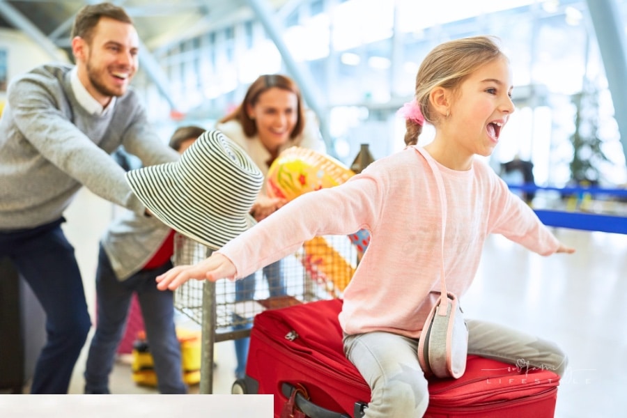 Happy family laughing at airport
