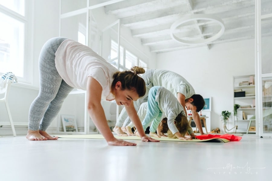 young family doing yoga