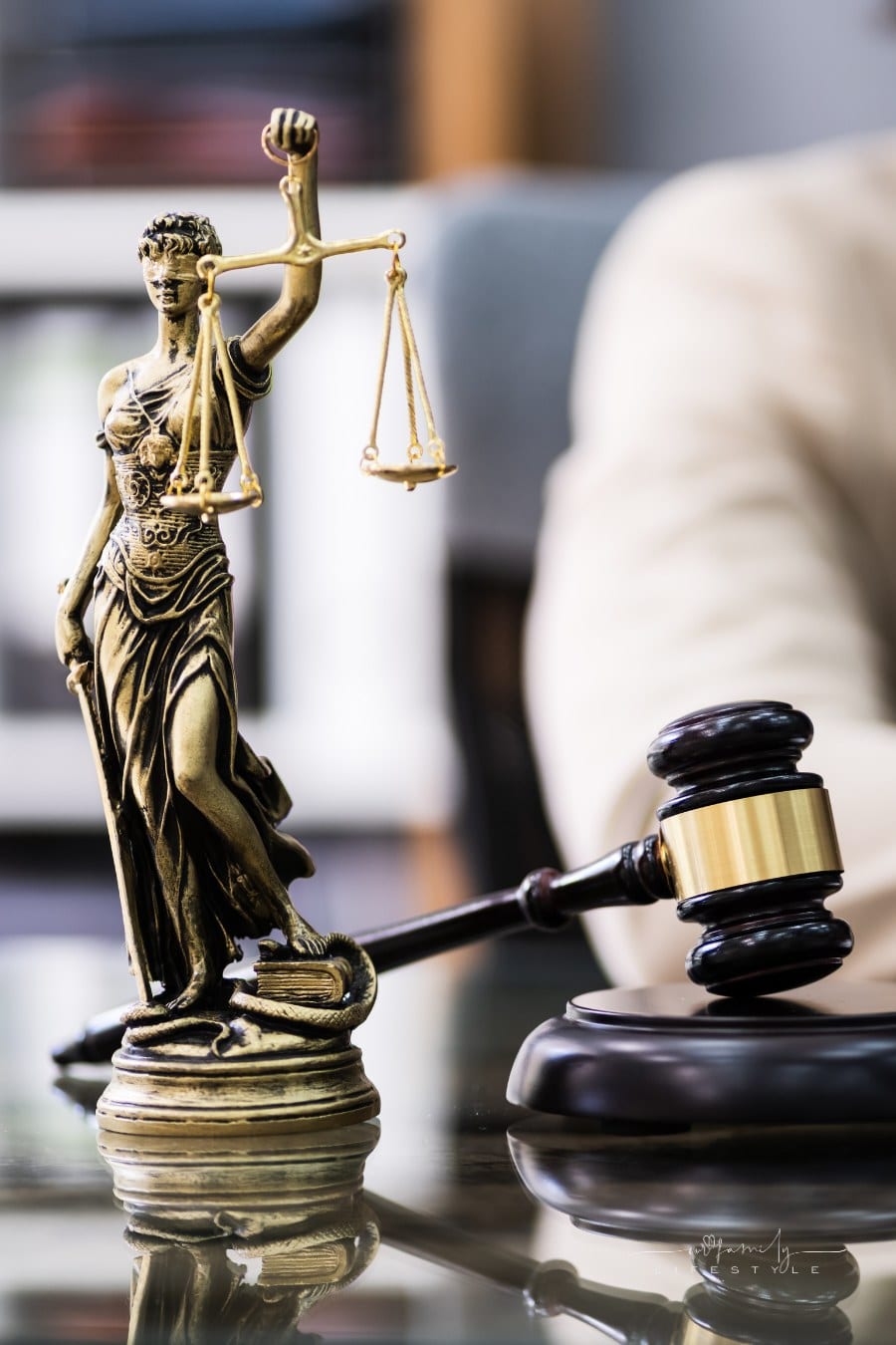 scales of justice next to judge's gavel on desk
