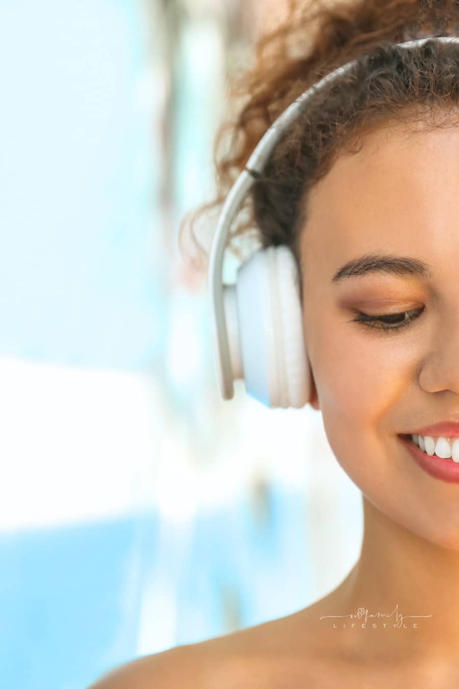 Beautiful African-American Woman Listening to Music Outdoors