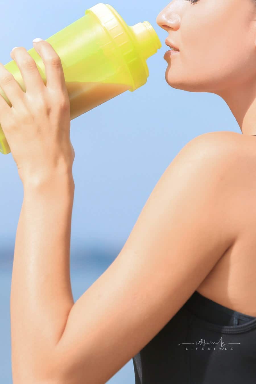 Young Woman Drinking Protein Shake
