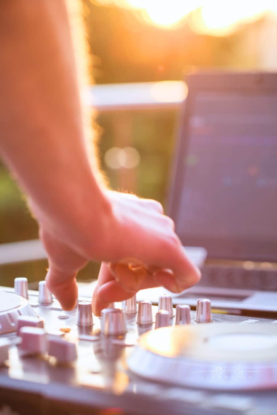 Dj mixing music outdoor.