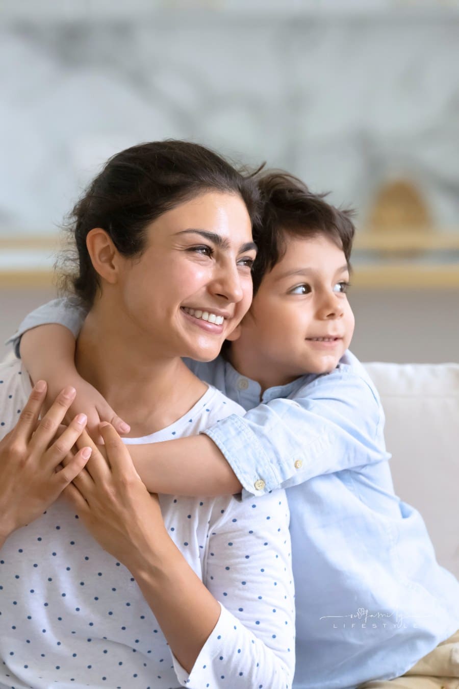 Young boy hugging his nanny