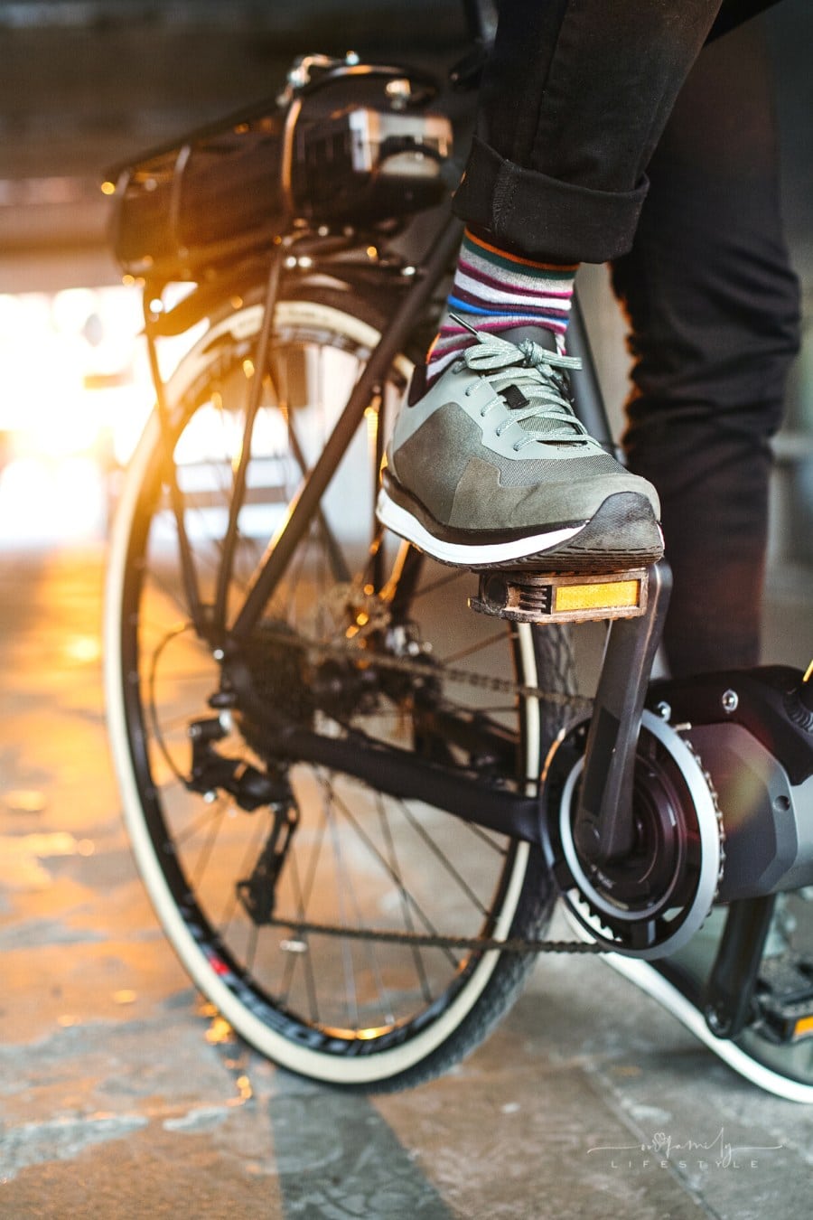 business man setting up electric bicycle for commute