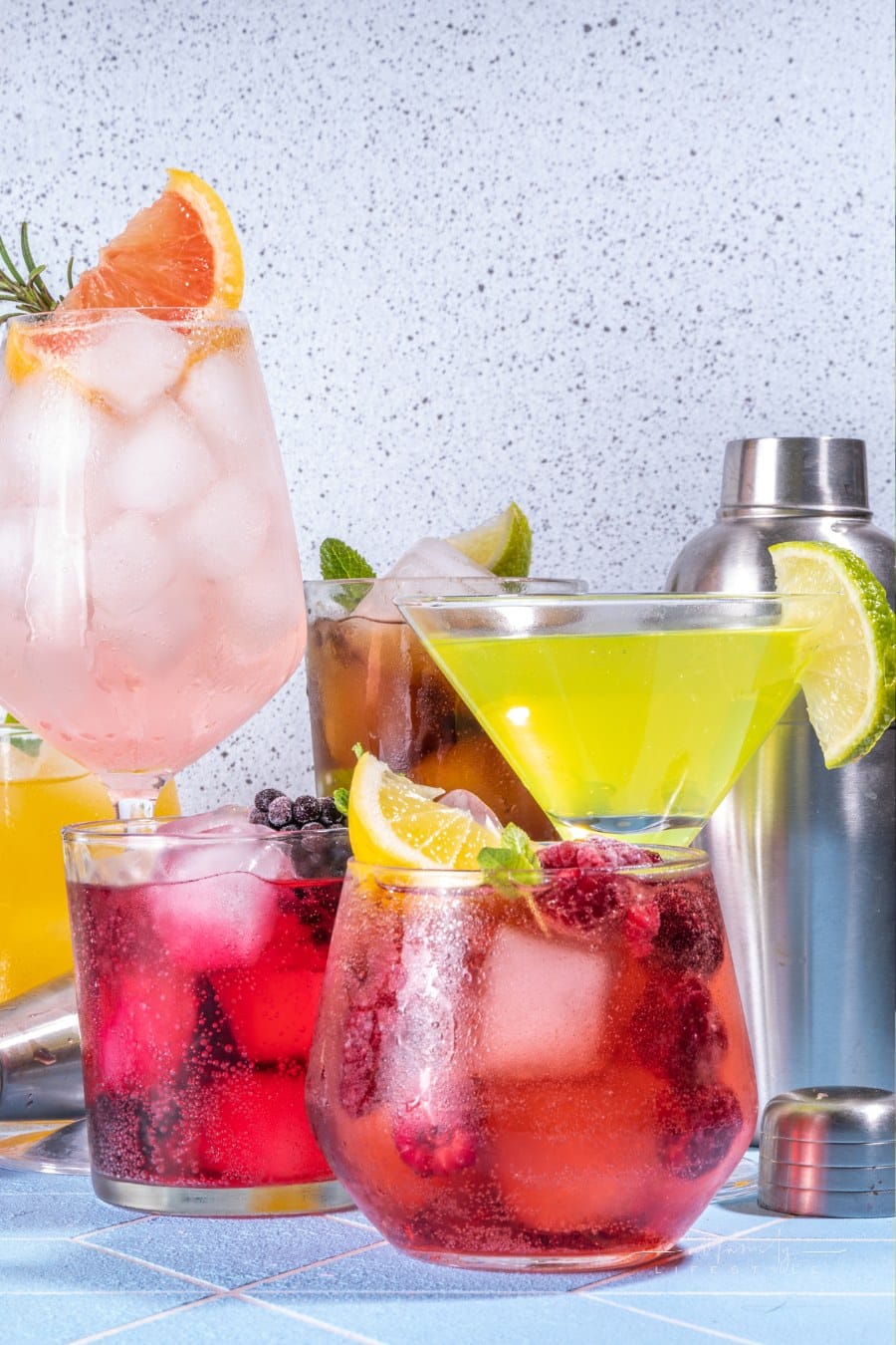 Summer bar cocktails menu. Set of different glasses variations of drinks, mocktails, cocktails, sparkling refreshing beach water. Citrus and fruit drinks with garnish and ice cubes