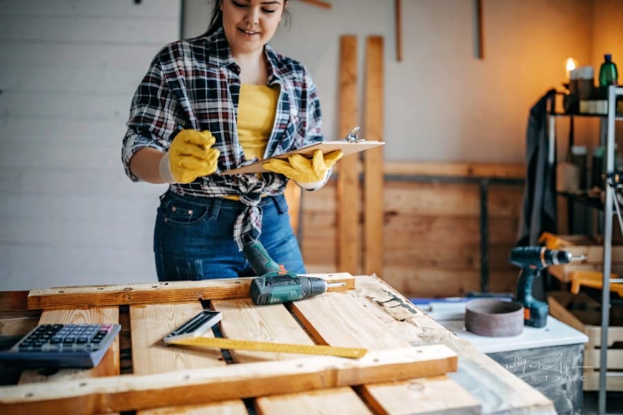 Teenager working on DIY project in her garage