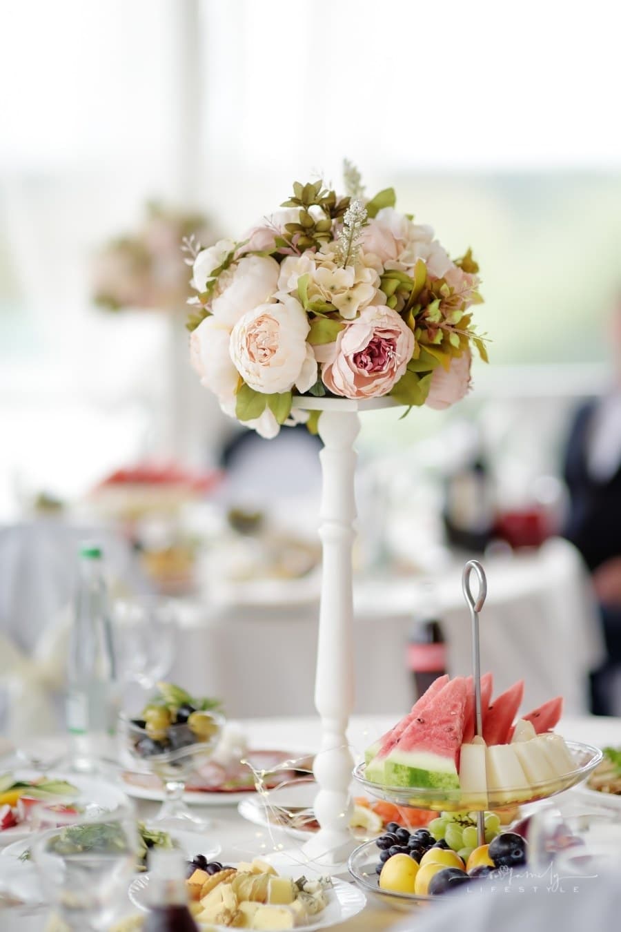 table set for reception with fruit and flowers