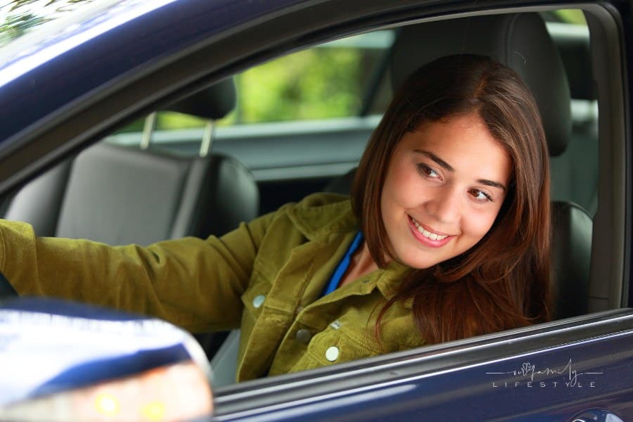 Teen driver Looking through side view Mirror