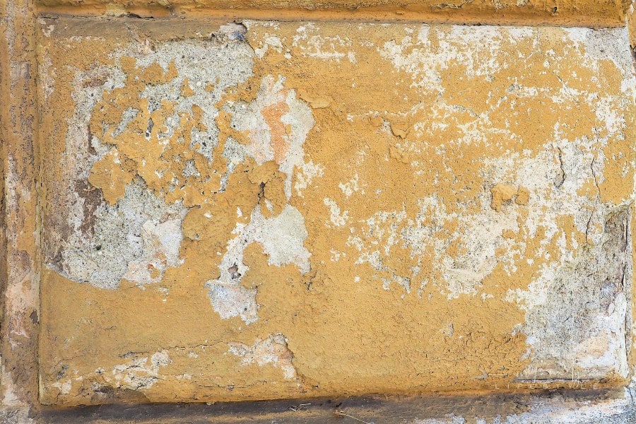 Damage caused by damp and moisture on a wall