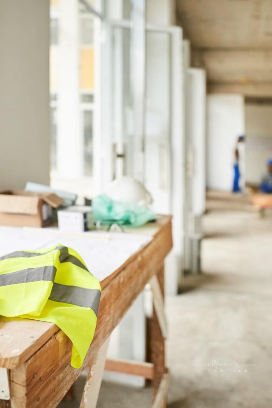 construction site with a workbench and construction vest