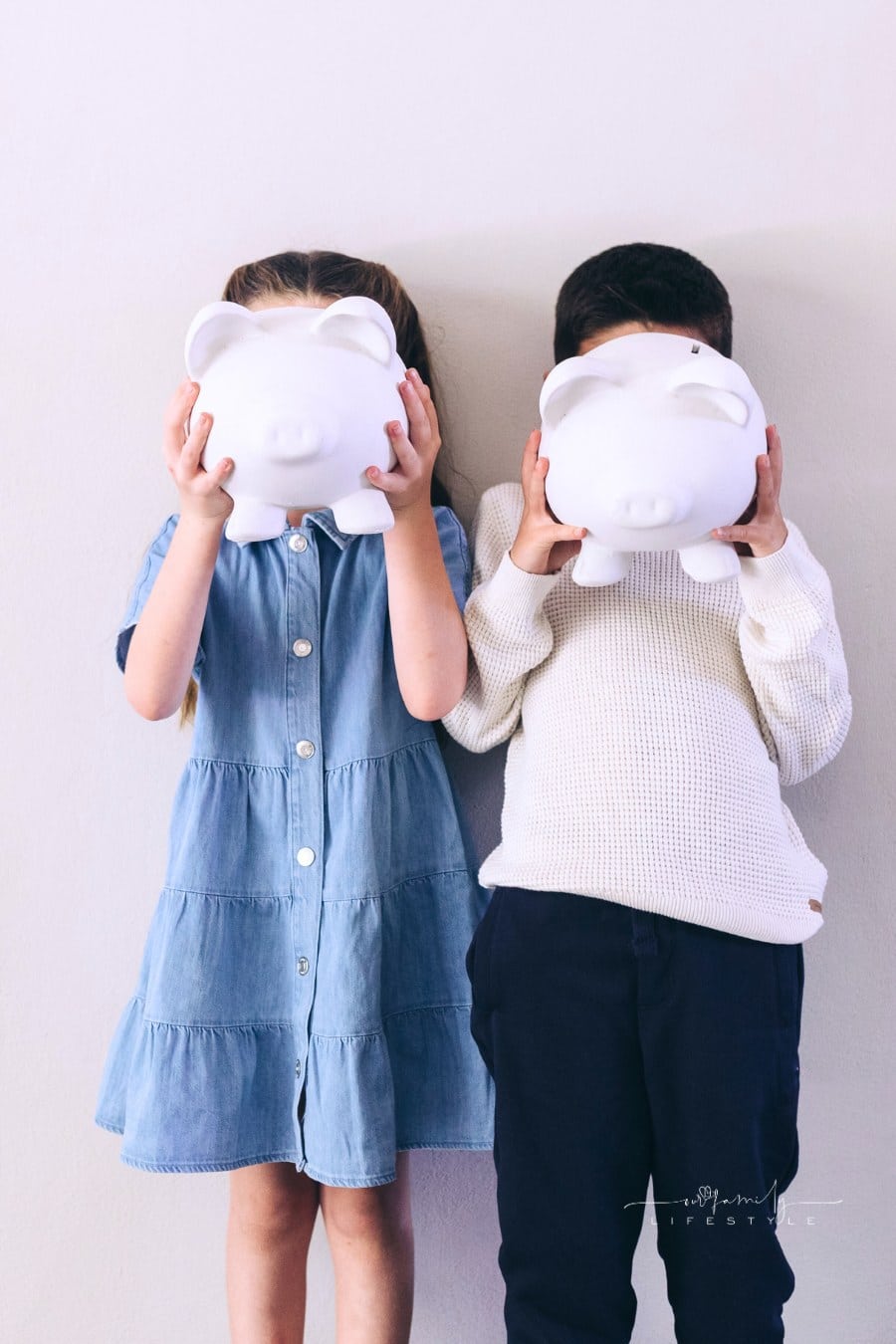 Children Holding Piggy Banks